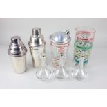 Two similar glass cocktail shakers / mixers, one with chrome lid, decorated with cocktail recipes,