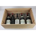 A bottle of Cordier Chateau Gruaud Larose Sant-Julien 1975, together with three bottles of La