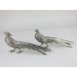 A pair of cast metal models of pheasants, 14cm high