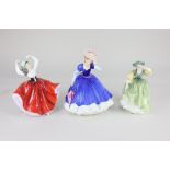 Five Royal Doulton porcelain figures of ladies, comprising 'Figure of the Year 1992 Mary', '