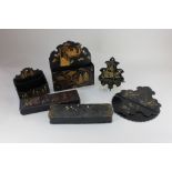 A collection of Japanese black lacquered items, with gilt decoration of figures, flowers and