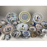 A collection of 19th and 20th century Quimper pottery, including plates decorated with men