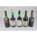 A bottle of Taylor's Qunita De Vargellas 1974 vintage port, and four various bottles of port to