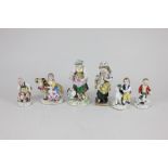 Three Sitzendorf porcelain figures of children with a lamb, chickens and geese, tallest 12cm high,