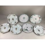 Four 18th century faience plates, two with polychrome floral design, two with green floral and