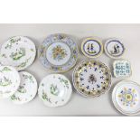 A collection of French and Italian faience pottery plates and dishes, to include pair of Henriot