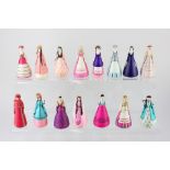 A collection of over fifteen paper Russian dolls, various painted costumes, 9.5cm high