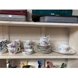 A Royal Crown Derby porcelain part tea set in the Derby Posies pattern, a Grosvenor porcelain part