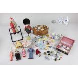 A collection of dolls house dolls and accessories, to include miniature food, glass and porcelain