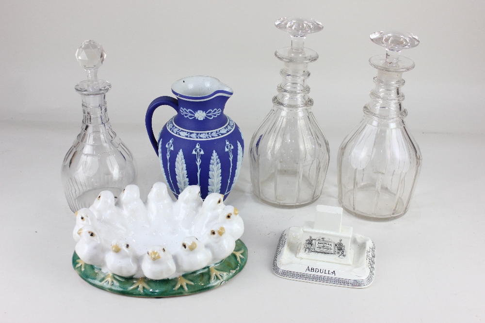 A 'Jasperware' blue and white porcelain jug, with foliate decoration (a/f), and three glass