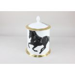 A Royal Crown Derby 'Equus' porcelain biscuit barrel, of cylindrical form, decorated with black