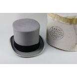 A grey top hat by Lock & Co, London, with black band, in box (box a/f)