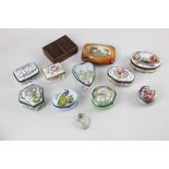 A collection of Continental enamel and porcelain gilt metal mounted pill and trinket boxes,