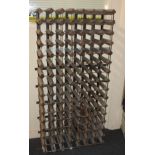 A wooden and metal framed wine rack to hold 105 bottles, 137.5cm by 66cm