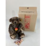 A Steiff Classic teddy bear, in mottled brown mohair, with all labels, in original box, 26cm long