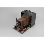 A Conley American mahogany and leather clad half plate camera (a/f)