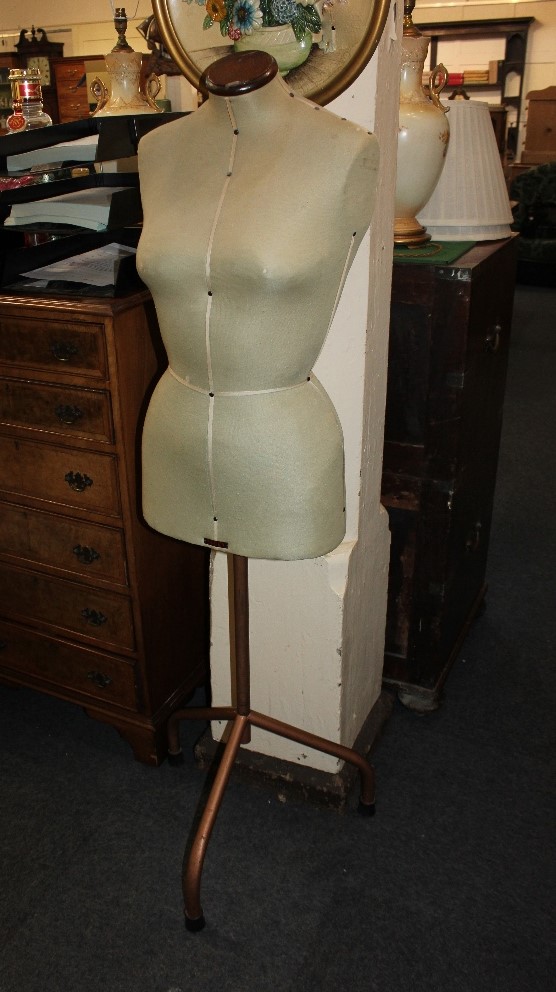 A Singer dressmaker's mannequin, on tubular metal tripod base