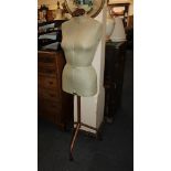 A Singer dressmaker's mannequin, on tubular metal tripod base