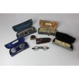 A collection of spectacles in cases, to include a tortoiseshell pair in tortoiseshell case, and