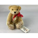 A Steiff Classic 1909 teddy bear, in beige mohair, with all labels, 23cm long