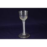 An 18th century wine glass, bucket type bowl with moulded flutes,