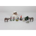 An early Britains lead gnome, 5.5cm high, and two lead camels, a monkey, a dog in a kennel and two