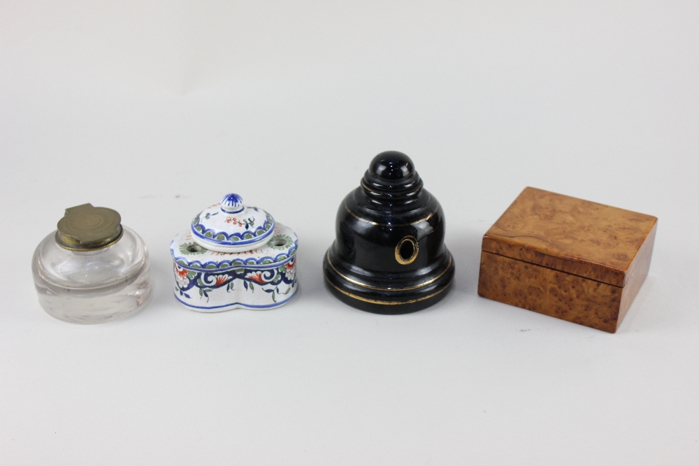 A Victorian bell shaped black glazed ink well, marked 'Williams's Ink Pot Rd No 331808, 11cm, and