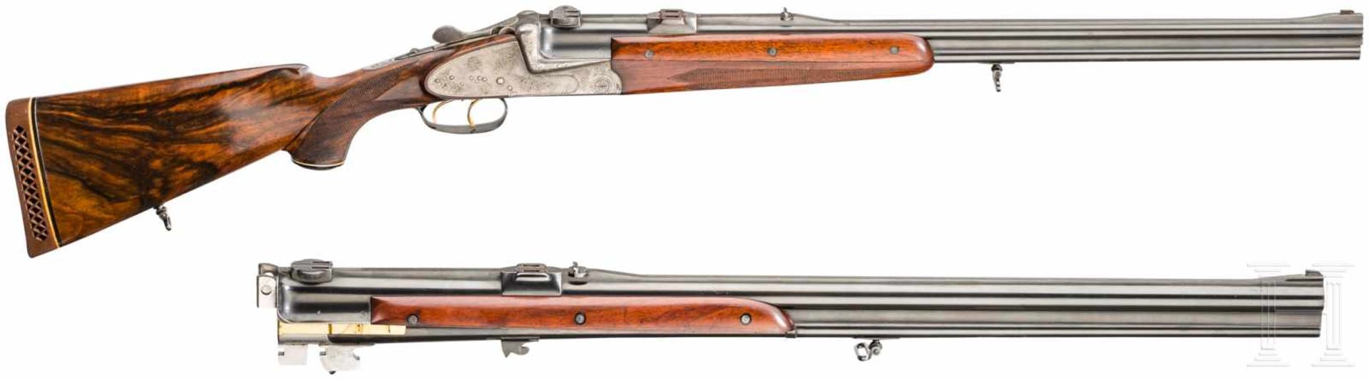 A cased O/U double rifle by Winkler, Ferlach, with Kahles scope and interchangeable O/U