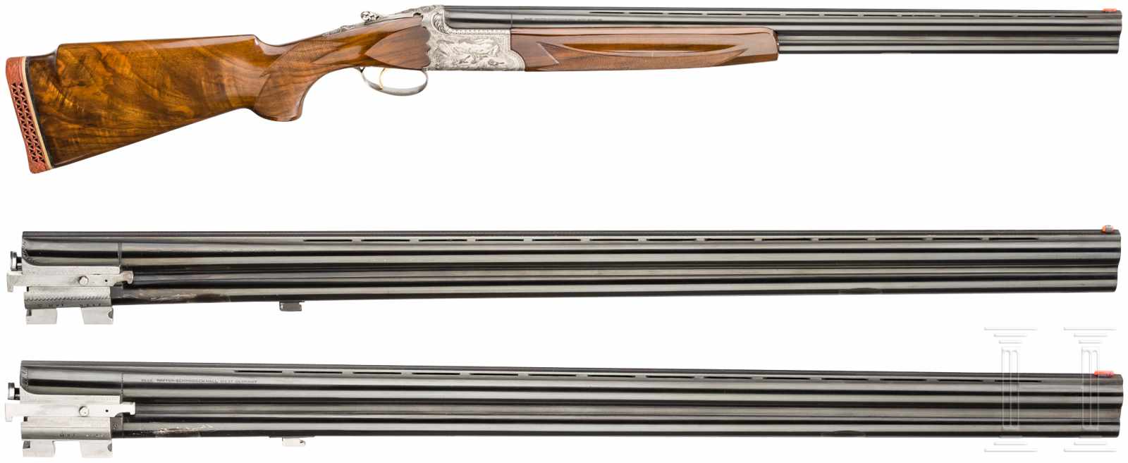 A cased over/under shotgun with two extra barrel sets, by I.A.B./Hege