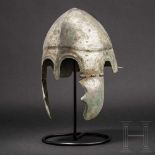 A Chalcidian helmet, type V, early 4th century B.C.Bronze helmet with full-faced tin plating with