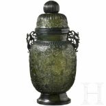 A large Chinese vase in chiselled jade, 19th centuryThe oval jade body carved in one piece,
