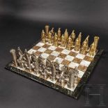 A magnificent chess set, probably Hanau, circa 1900Figures in silver, partially gilt, mark of