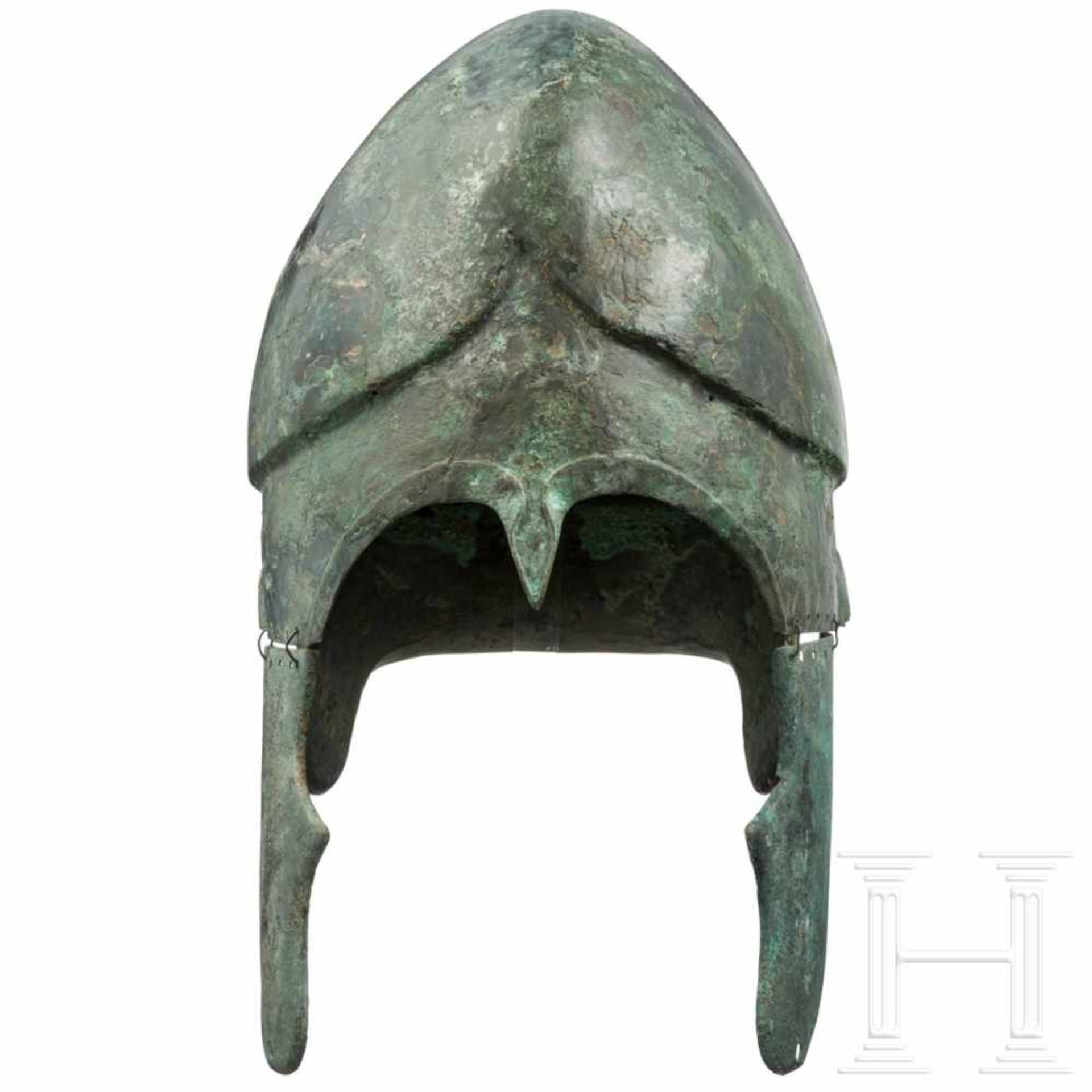 A South-East European Chalcidian helmet, type V, 4th century BCThe skull hammered in one piece, with