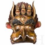 A Tibetan dance mask in the form of a Garuda, 20th centuryThe mask made of several pieces in