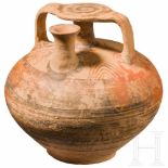 A huge Mycenean jug, 12th century B.C.The spherical belly with surrounding red and dark-brown