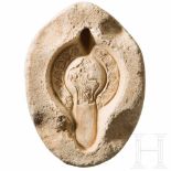 A Roman limestone mould for the upper half of oil lamps, North Africa, 4th - 5th century A.D.