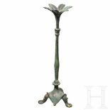A Byzantine bronze candelabrum, 6th centuryA bronze candelabrum on three feet. A stylised flower