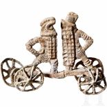 A Roman minature votive wagon with two fighting gladiators, 1st - 2nd century A.D.Lead with grey