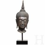 A fine bronze head of a Thai Buddha, 18th centuryFully sculptured bronze cast with a dark patina and