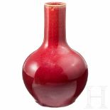 A Chinese celadon vase with oxblood overglaze, circa 1900Minor traces due to age. Stand ring