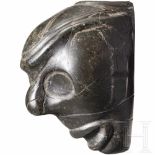 A Caribbean Taíno mask head, 11th-15th centuryMask-like head made of black, polished serpentine (