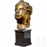 An Italian Baroque head of a putto, 17th centuryGilt copper sculpture of an angel’s head in half