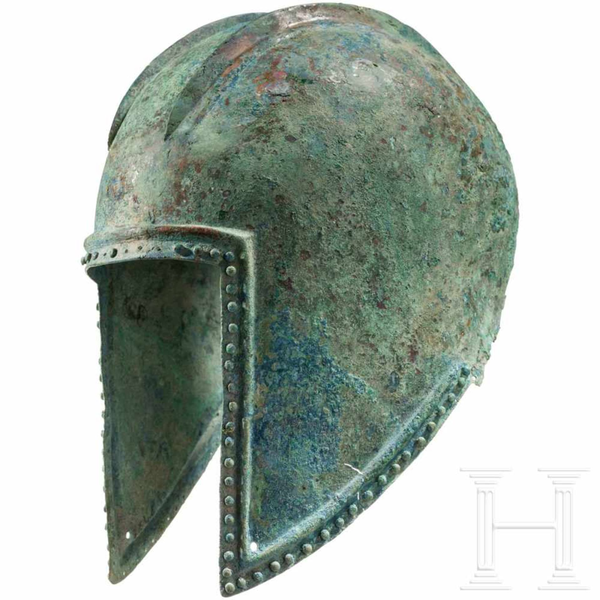 An Illyrian helmet, 5th century B.C.The hemispherical, hammered helmet skull with two raised, - Bild 2 aus 5