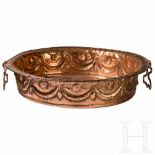 A large Italien Baroque copper dish, probably Florence, 17th centuryEmbossed copper with decorations