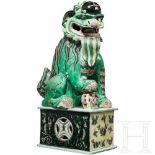 A large Chinese foo dog in porcelain, 19th centuryWhitish porcelain with a yellow, green and