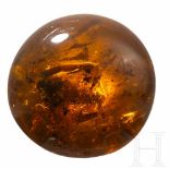 An Myanmar amber ball with scorpion incluseGeschliffene und polierte Kugel aus natürlich