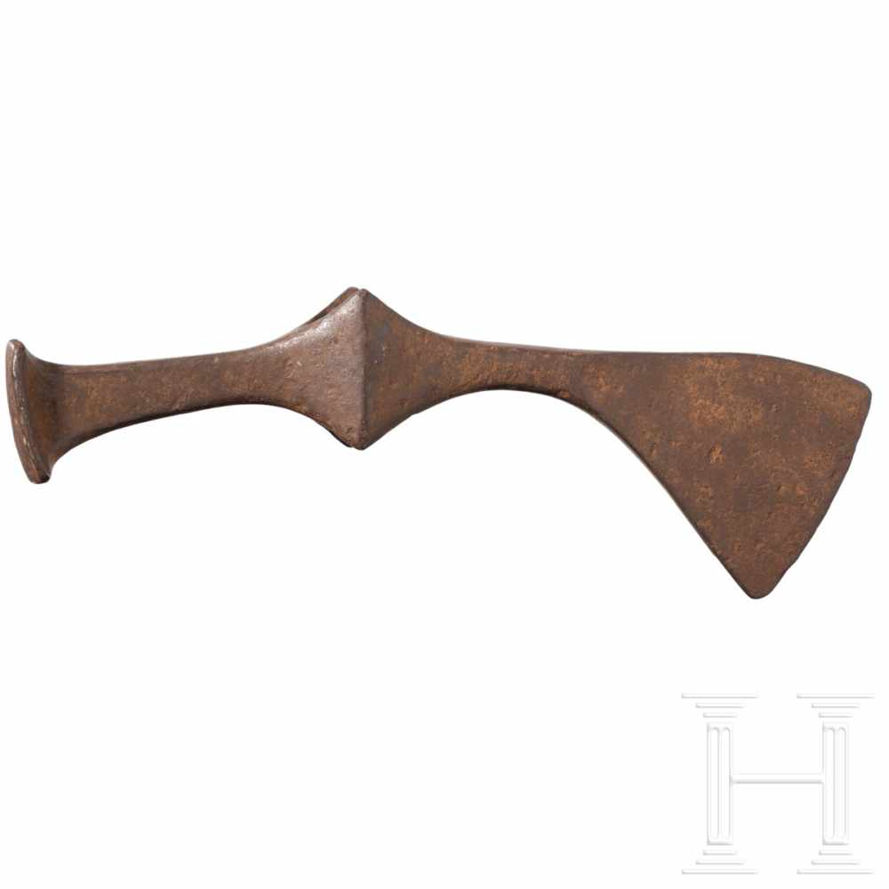 A Scythian battle axe head, 5th – 3rd century B.C.An iron battle axe head with blade pointing