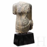 A life-sized torso of a Buddha statue, probably Gandhara, 1st - 3rd centurySculptured in stone.