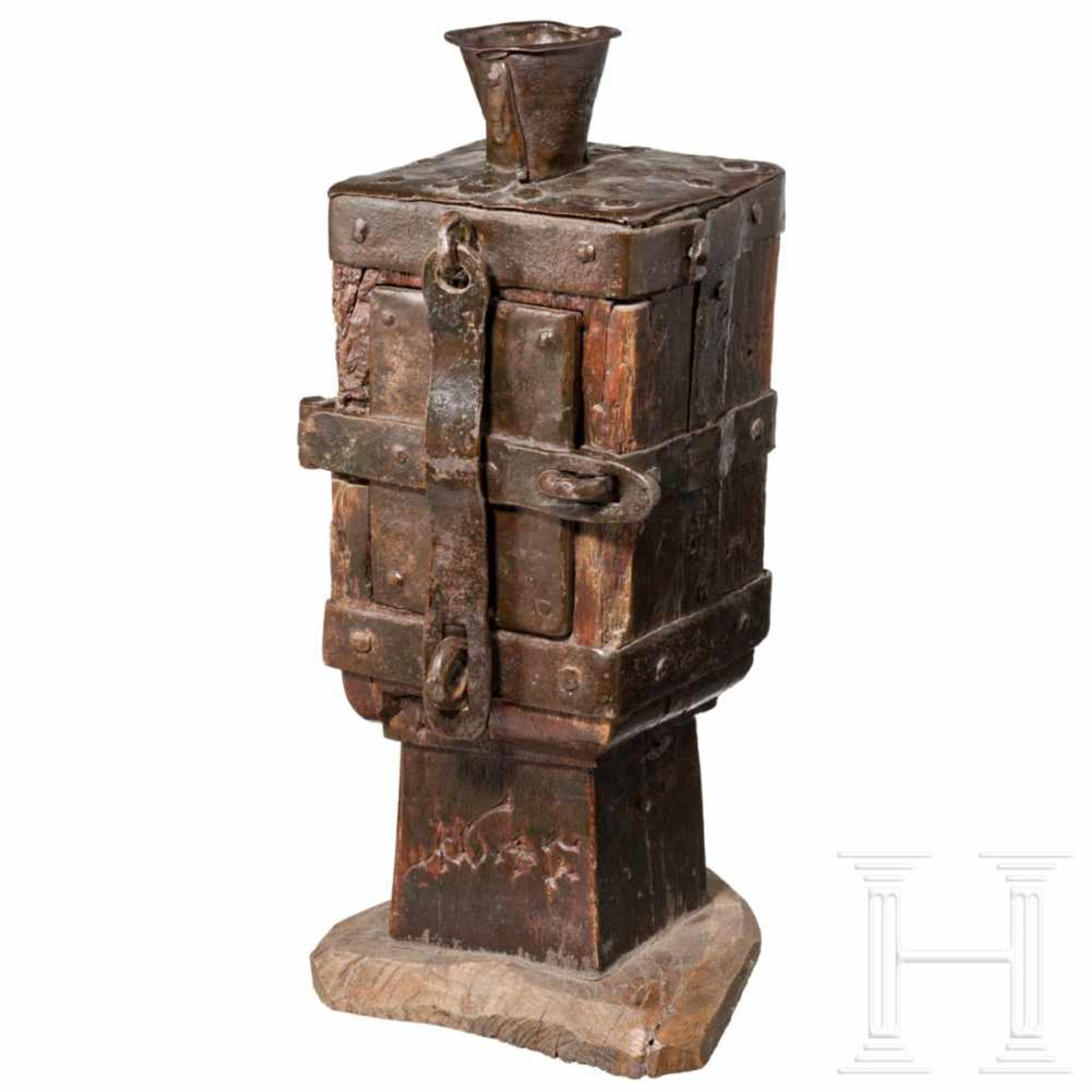 A dated South German iron mounted offertory box, 17th centuryOne door. Forged iron on strong