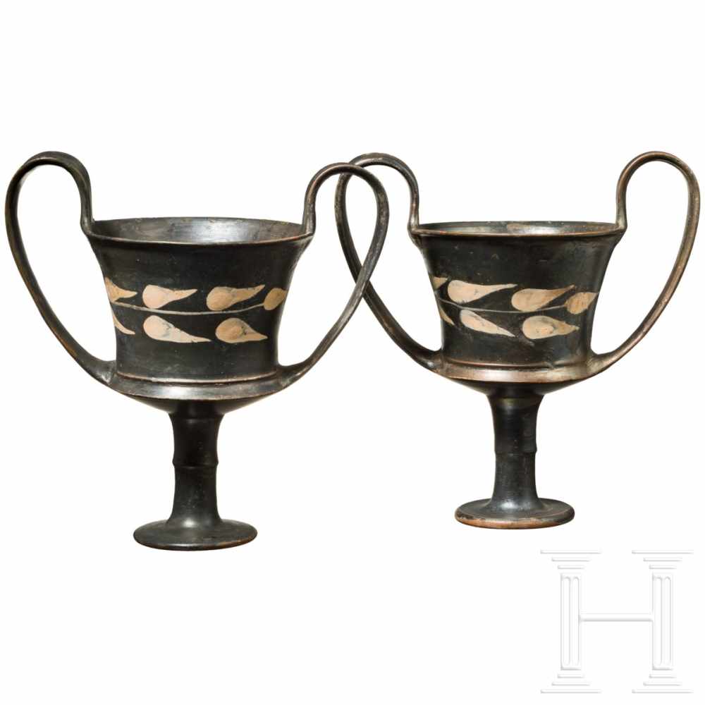 Two Boeotian kantharoi, 5th century B.C.Two large black glazed kantharoi with deep bowl and tall